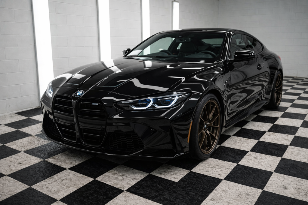 Black BMW M4 receiving ceramic coating service in Rockhampton by Top Shelf Detailing
